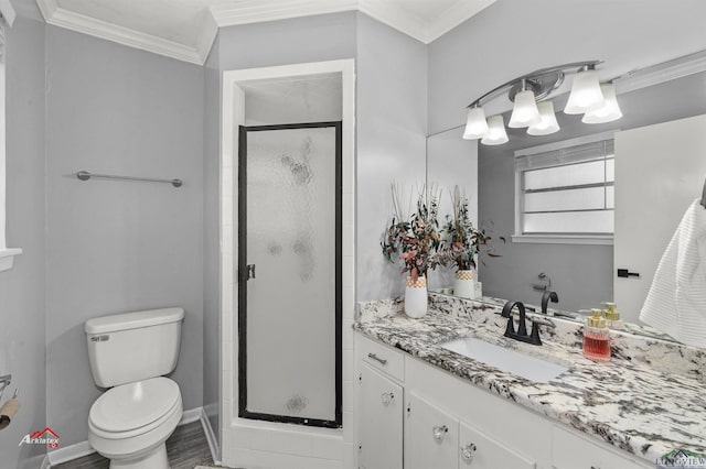 bathroom with an enclosed shower, ornamental molding, vanity, hardwood / wood-style floors, and toilet