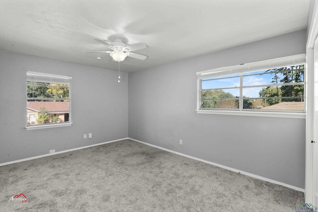 carpeted empty room featuring ceiling fan