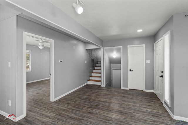 interior space with ceiling fan and dark wood-type flooring