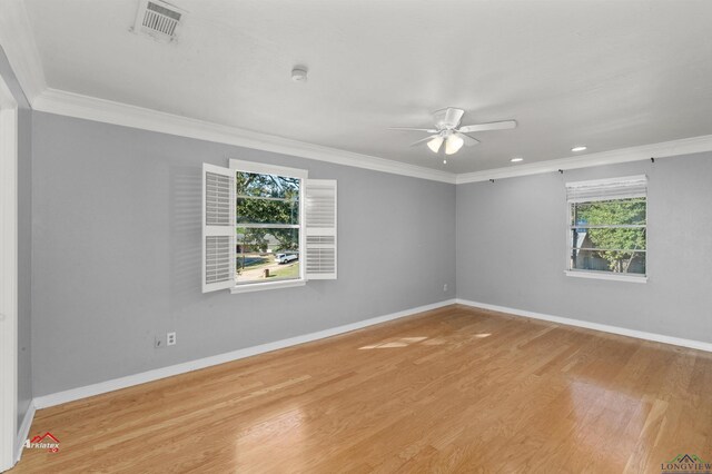 spare room featuring light hardwood / wood-style floors, ceiling fan, and crown molding