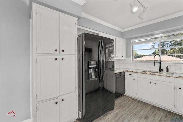 kitchen with sink, white cabinetry, and black appliances