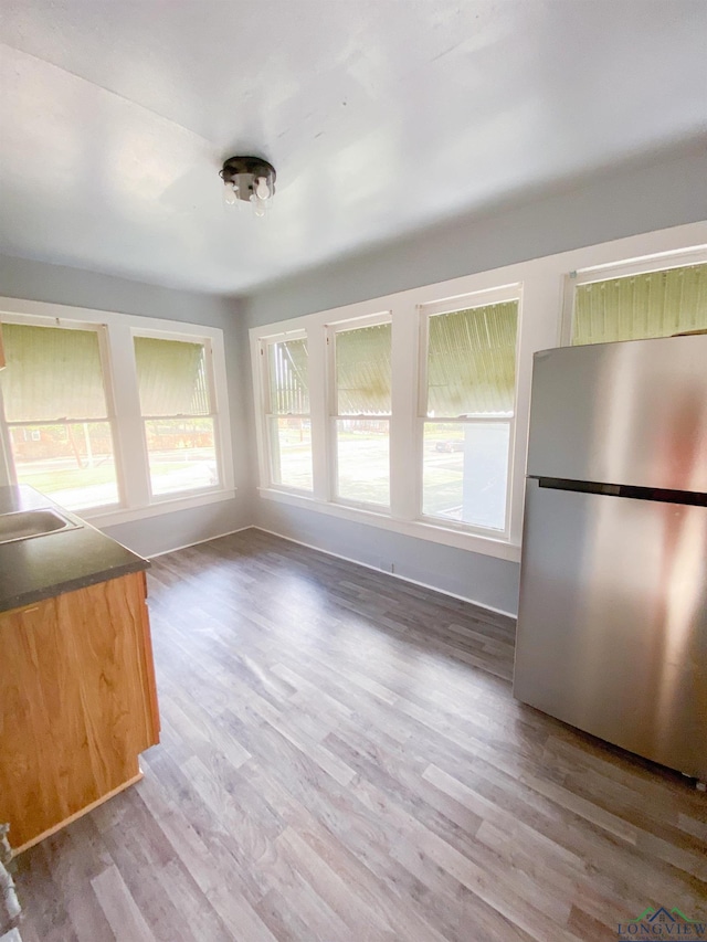 unfurnished dining area with hardwood / wood-style floors