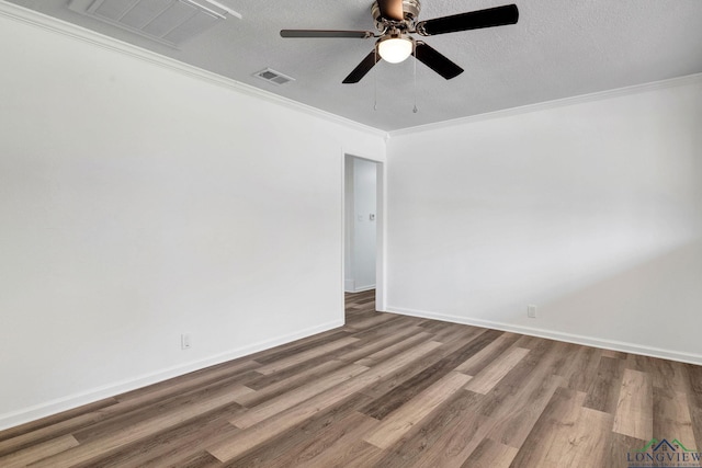 empty room featuring hardwood / wood-style floors, a textured ceiling, ceiling fan, and ornamental molding