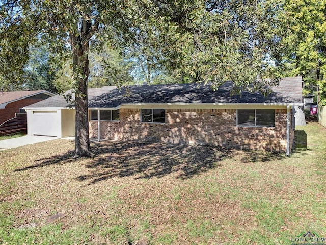 ranch-style house with a front yard and a garage