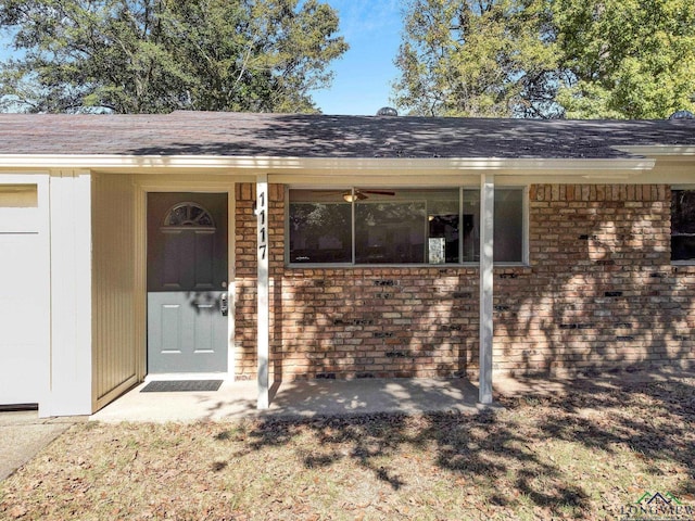 view of exterior entry featuring a porch