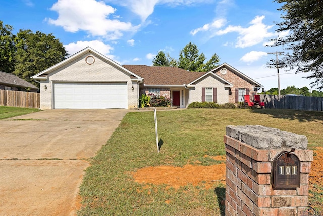 single story home with a front yard and a garage