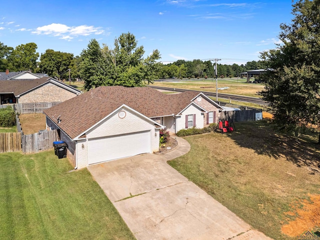 view of front facade featuring a front lawn and a garage