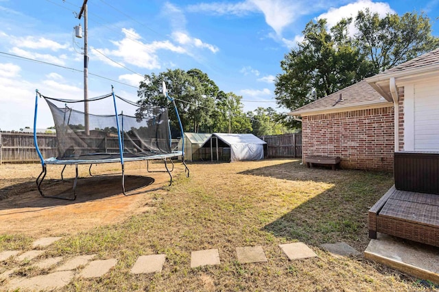 view of yard featuring a trampoline