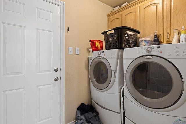 laundry area with cabinets and washer and dryer