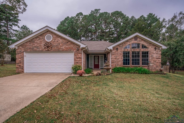 ranch-style house with a garage and a front lawn