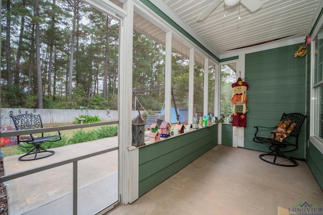 sunroom / solarium with ceiling fan and plenty of natural light