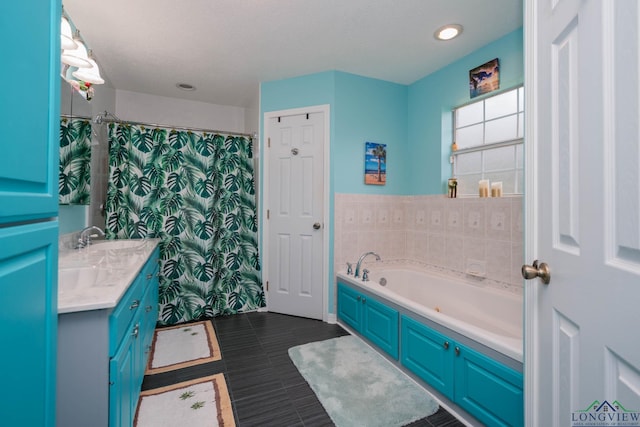 bathroom featuring vanity and shower with separate bathtub