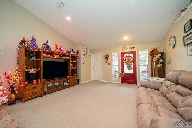 living room featuring carpet and vaulted ceiling