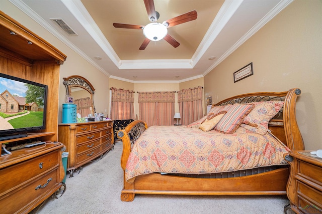2120 Page Rd, Longview, TX 75601 - bedroom with a tray ceiling, light colored carpet, ornamental molding, and a ceiling fan