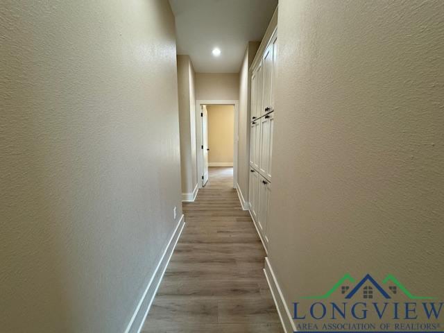 hallway featuring light hardwood / wood-style flooring