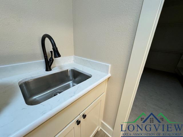 details with sink and white cabinets