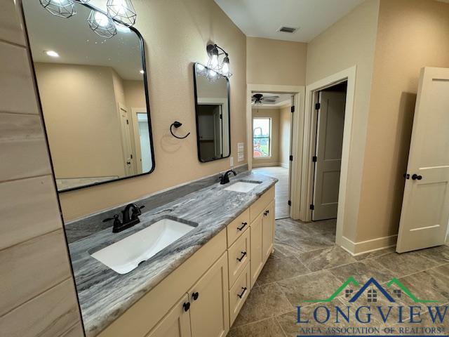 bathroom with vanity and ceiling fan