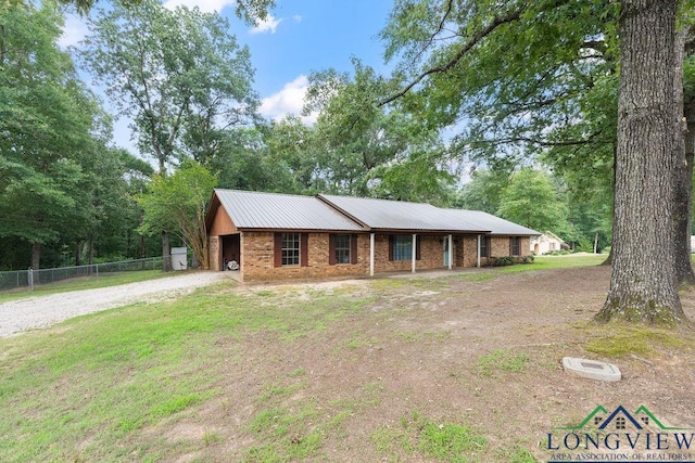 201 County Road 3668, Center, TX 75935 - ranch-style home with dirt driveway and metal roof