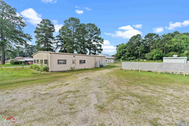 707 Willow St, Carthage, TX 75633 - back of property featuring an outbuilding