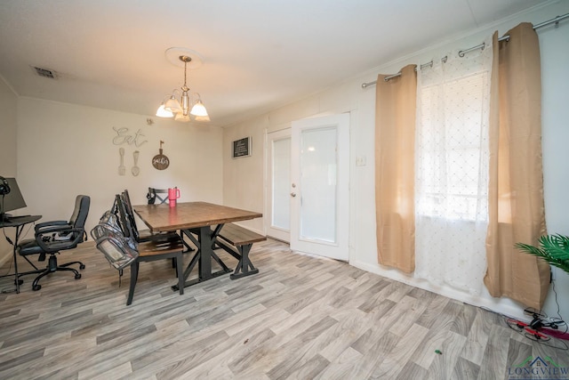 10816 Fm 2685, Gladewater, TX 75647 - dining area featuring light wood-style flooring and a chandelier