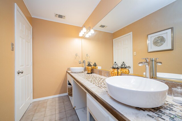 bathroom featuring tile patterned floors, vanity, and crown molding