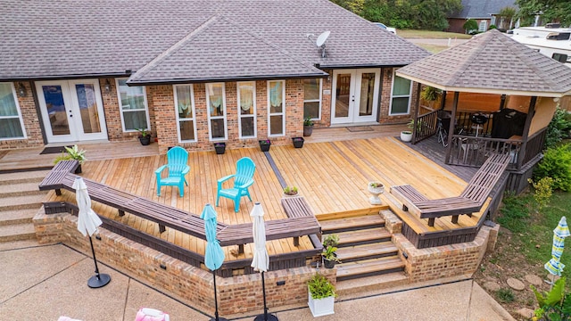 wooden deck featuring french doors