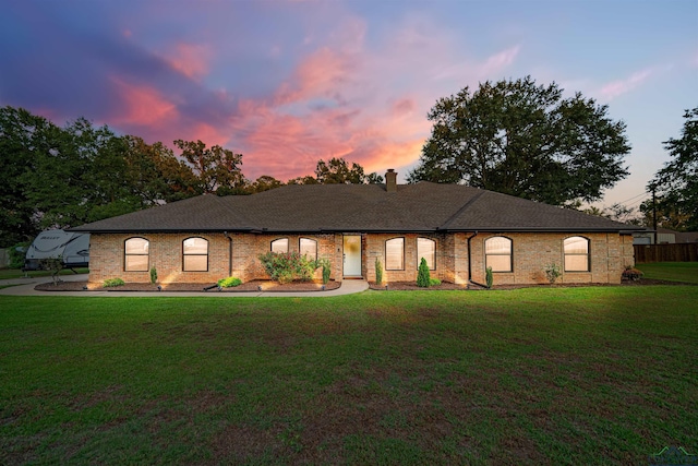 view of front of property with a lawn