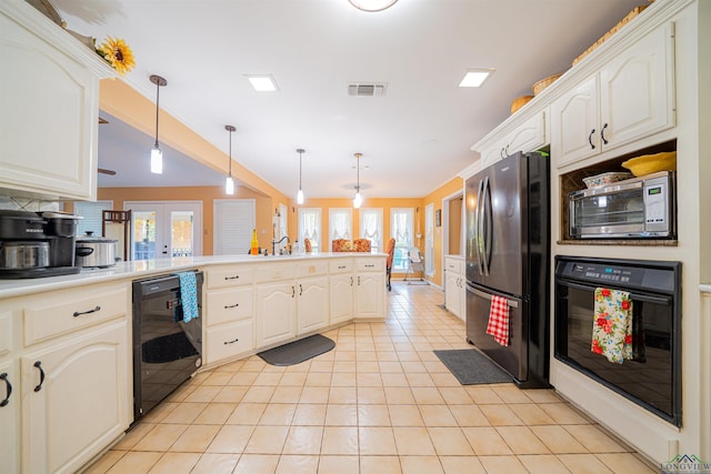 kitchen featuring french doors, black appliances, hanging light fixtures, light tile patterned floors, and kitchen peninsula