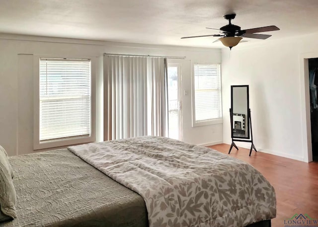 bedroom with ceiling fan and hardwood / wood-style floors