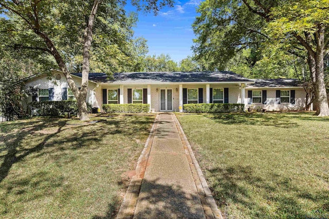 single story home featuring a front lawn and covered porch