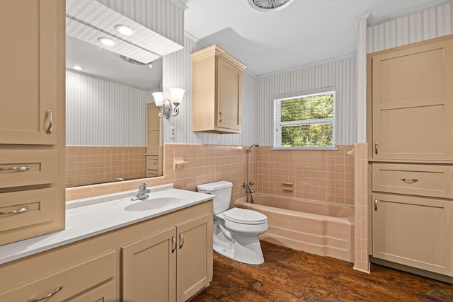 bathroom featuring hardwood / wood-style floors, vanity, crown molding, toilet, and tile walls