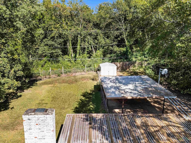 exterior space with a yard and a shed