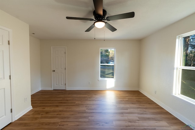 empty room with ceiling fan and light hardwood / wood-style floors