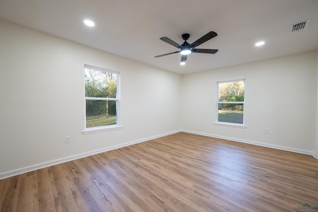 spare room featuring ceiling fan and light wood-type flooring