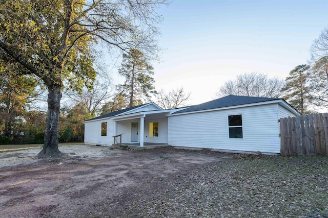 ranch-style house with covered porch