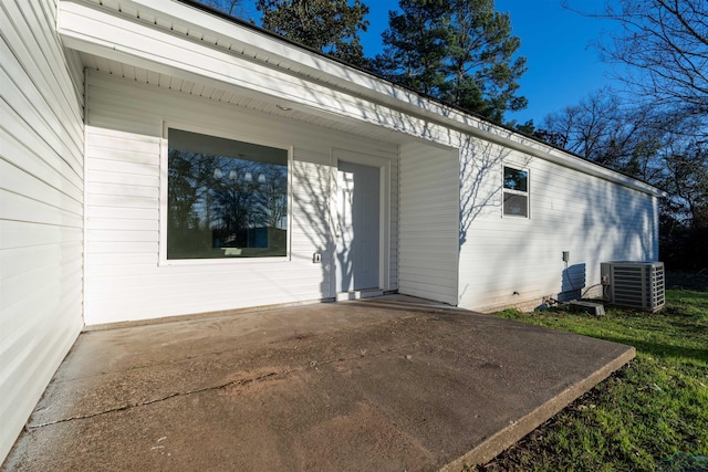 exterior space with a patio area and central AC