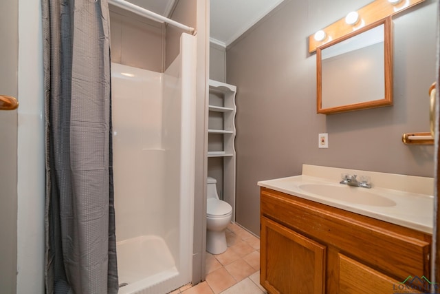 bathroom with vanity, crown molding, tile patterned flooring, toilet, and walk in shower