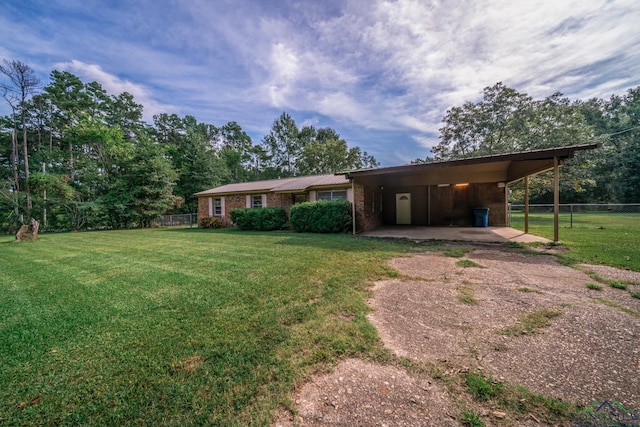 exterior space with a front yard and a carport