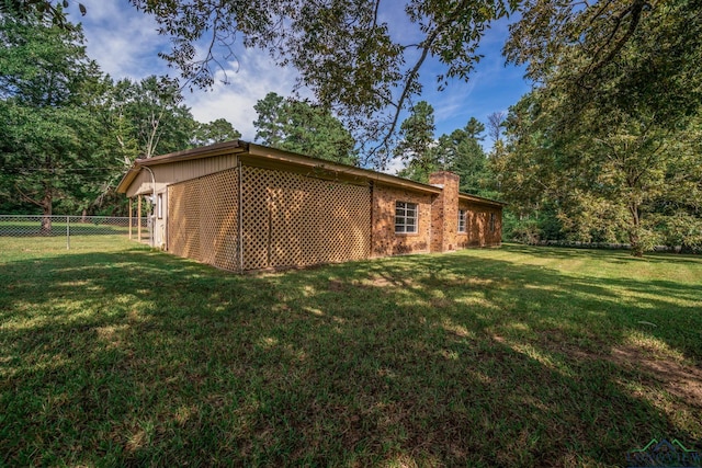 view of home's exterior featuring a lawn