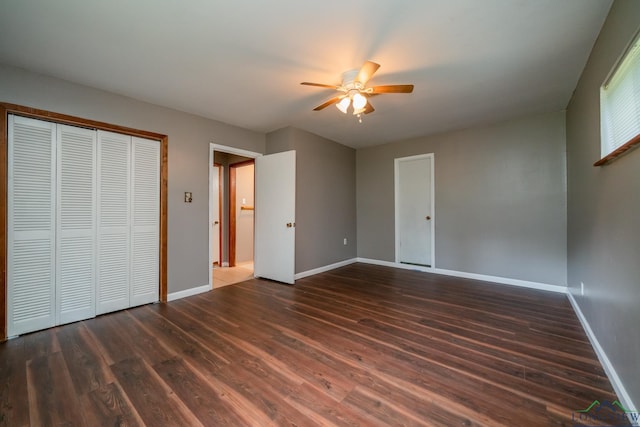 unfurnished bedroom featuring ceiling fan and dark hardwood / wood-style floors