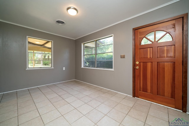 tiled entrance foyer with ornamental molding