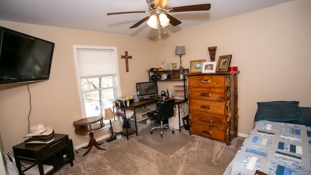 carpeted bedroom featuring baseboards and ceiling fan