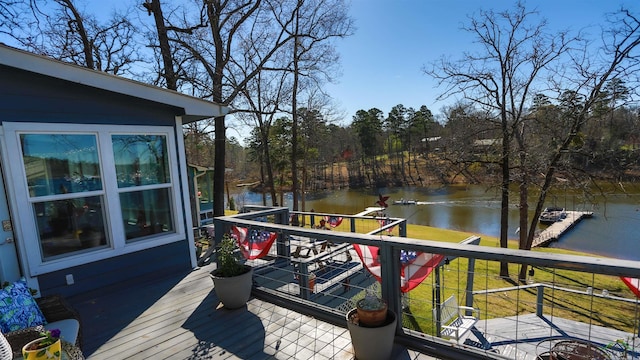 wooden terrace featuring a water view