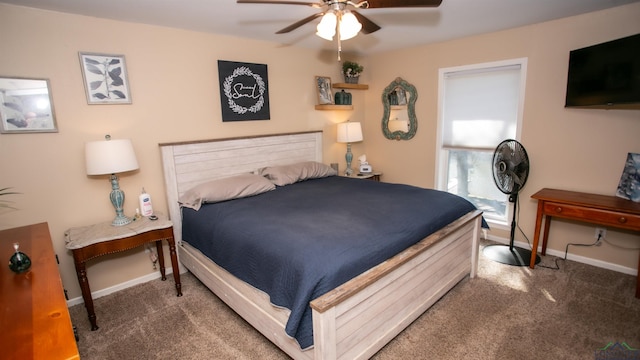 carpeted bedroom with baseboards and ceiling fan