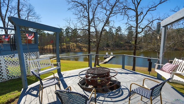 view of patio featuring an outdoor fire pit and a water view
