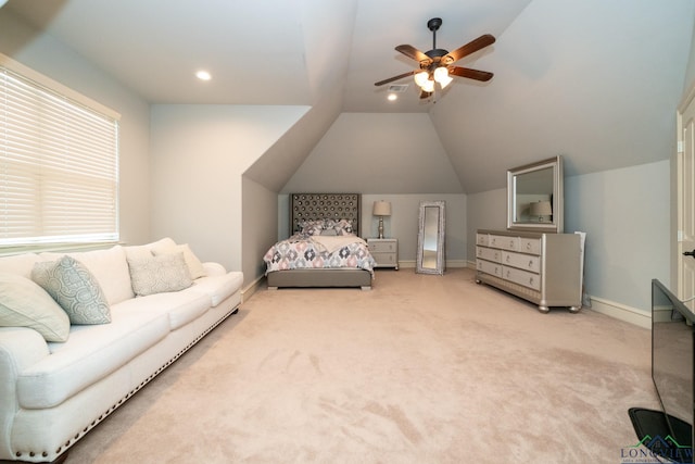 carpeted bedroom featuring ceiling fan and lofted ceiling