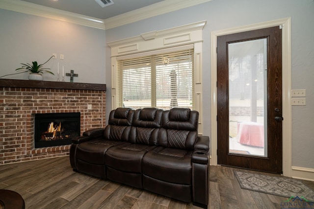 living room with a fireplace, dark hardwood / wood-style flooring, and ornamental molding