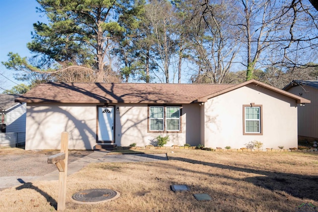 ranch-style house with a front yard