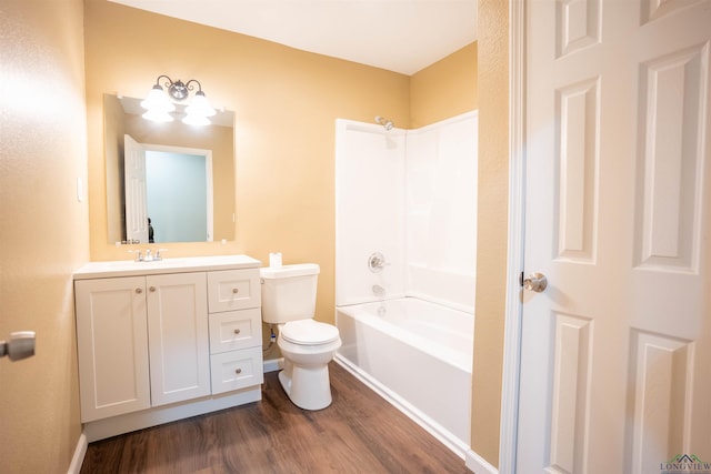 full bathroom with vanity, shower / bathing tub combination, hardwood / wood-style flooring, and toilet