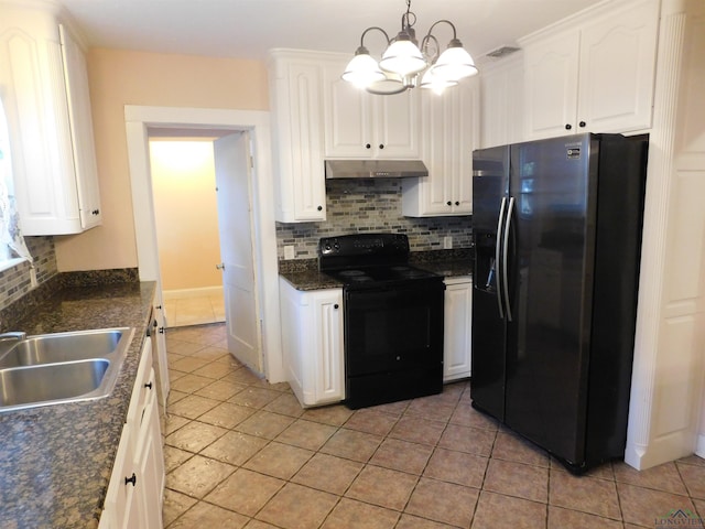 kitchen with backsplash, white cabinets, refrigerator with ice dispenser, black electric range, and hanging light fixtures